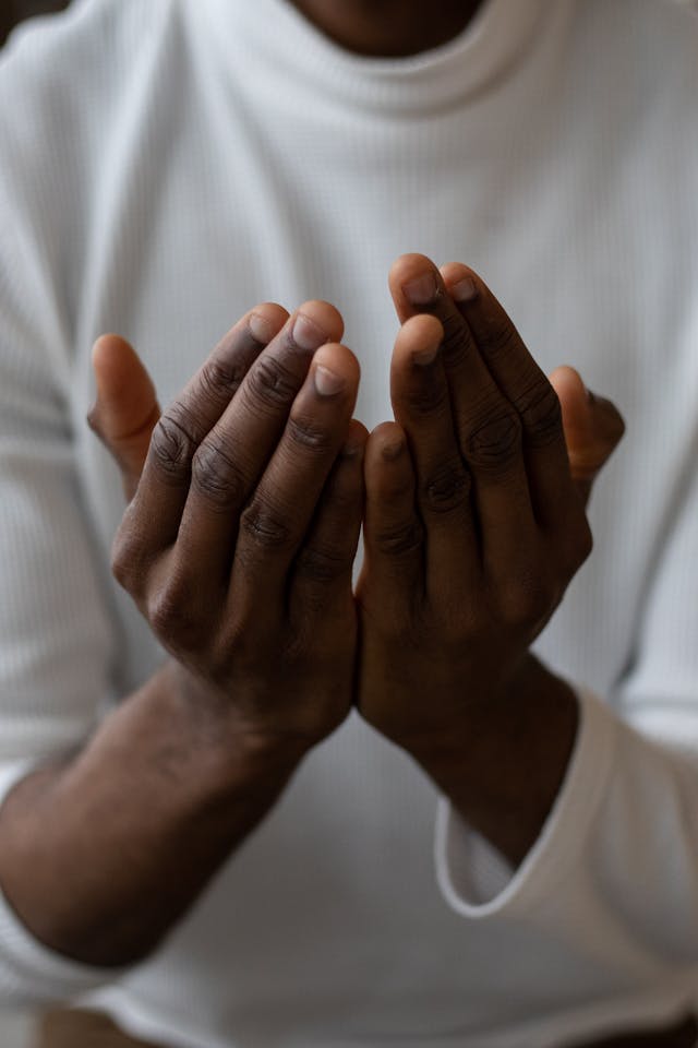 Cupped hands in prayer, illustrating what does the bible say about the subconscious mind and inviting God to shape hidden thoughts and habits
