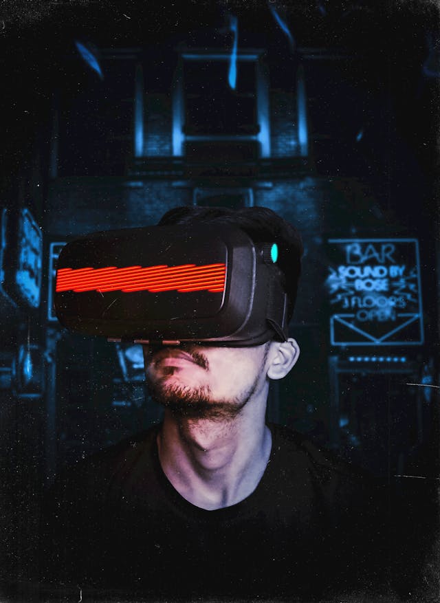 Man wearing a VR headset with red light in a neon-lit room, symbolizing ways to bend the reality and reshape perception