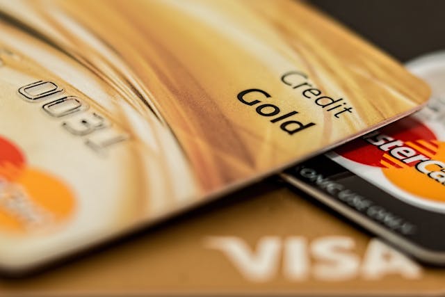 Managing Debt and Credit Wisely Close-up of gold and silver credit cards stacked together