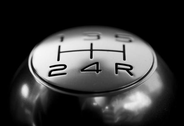 Shifting Your Energy Into Alignment Close-up of a gear shift knob symbolizing a shift in mindset and energy