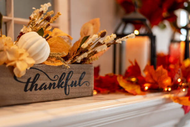 Autumn Gratitude Altar — One Word Manifestation Fall mantel with candles, leaves, and a wooden box labeled “thankful,” symbolizing one word manifestation through the felt frequency of gratitude.