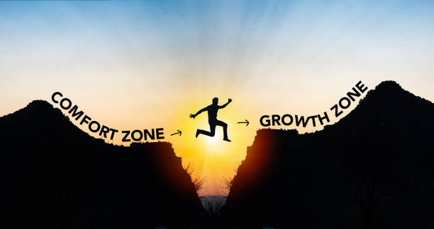 Man jumping from comfort zone to growth zone. Success and change concept . Silhouette of a person jumping from the comfort zone to the growth zone at sunrise, symbolizing transformation through a daily manifestation routine.