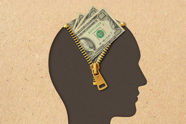Silhouette head unzipped with dollar bills emerging, symbolizing mindset shifts for the money law of attraction.