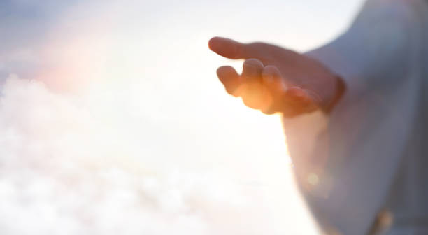 The Invitation of Divine Guidance An illuminated outstretched hand symbolizing divine guidance and how to know God is speaking to you.