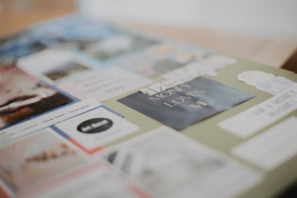 A close-up of a vision board featuring inspirational quotes, images, and money manifestation messages.