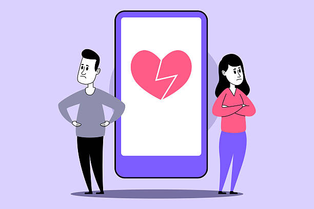 Illustration of an unhappy couple standing apart with a cracked heart on a large phone screen between them - manifesting a soulmate
