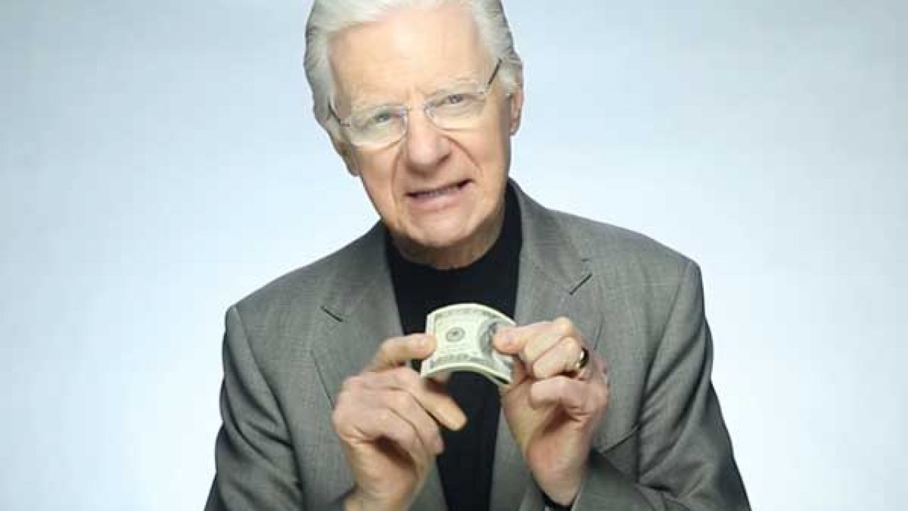 Do Money Affirmations Really Work Motivational speaker Bob Proctor holding a dollar bill while teaching wealth principles and exploring the question do money affirmations really work.