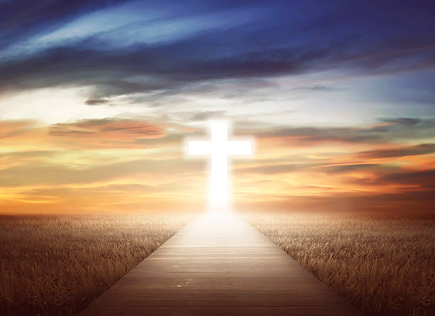 Glowing cross at the end of a path during sunrise, symbolizing faith, surrender, and is manifestation biblical belief